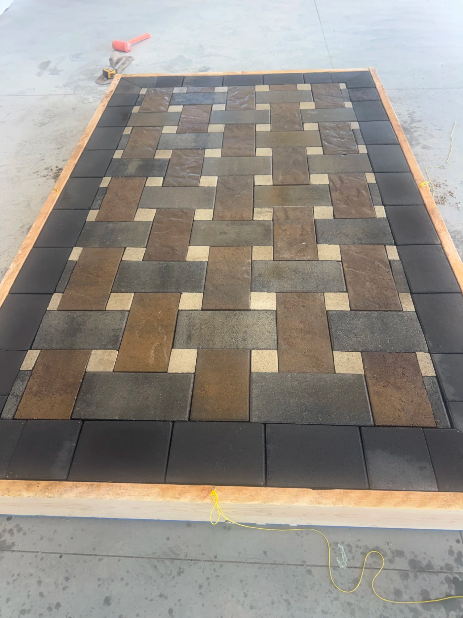 Basket weave paver patio installation by EC Landscaping in Roy Utah