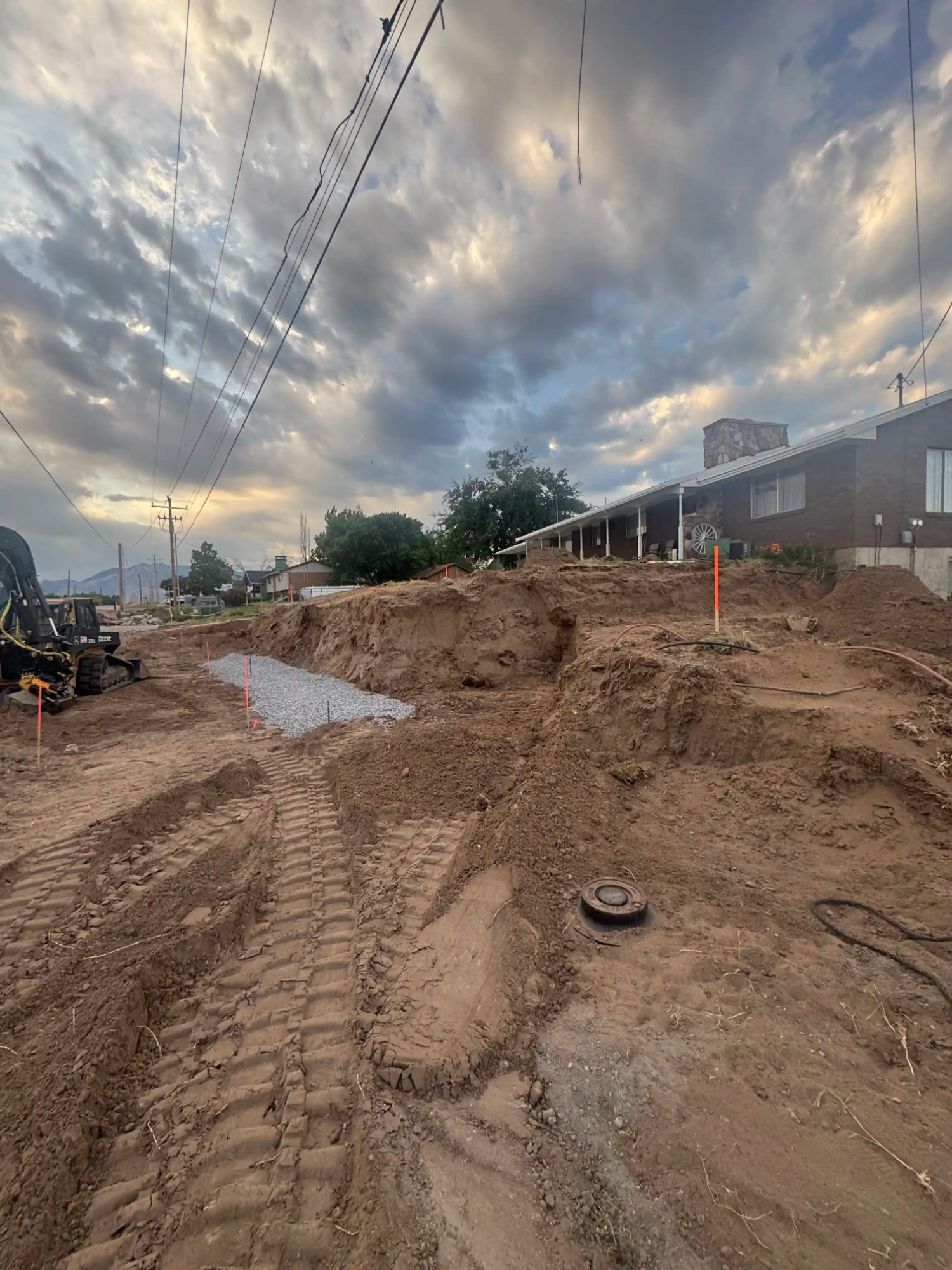 Professional site grading with skid steer equipment by EC Landscaping in Clearfield Utah