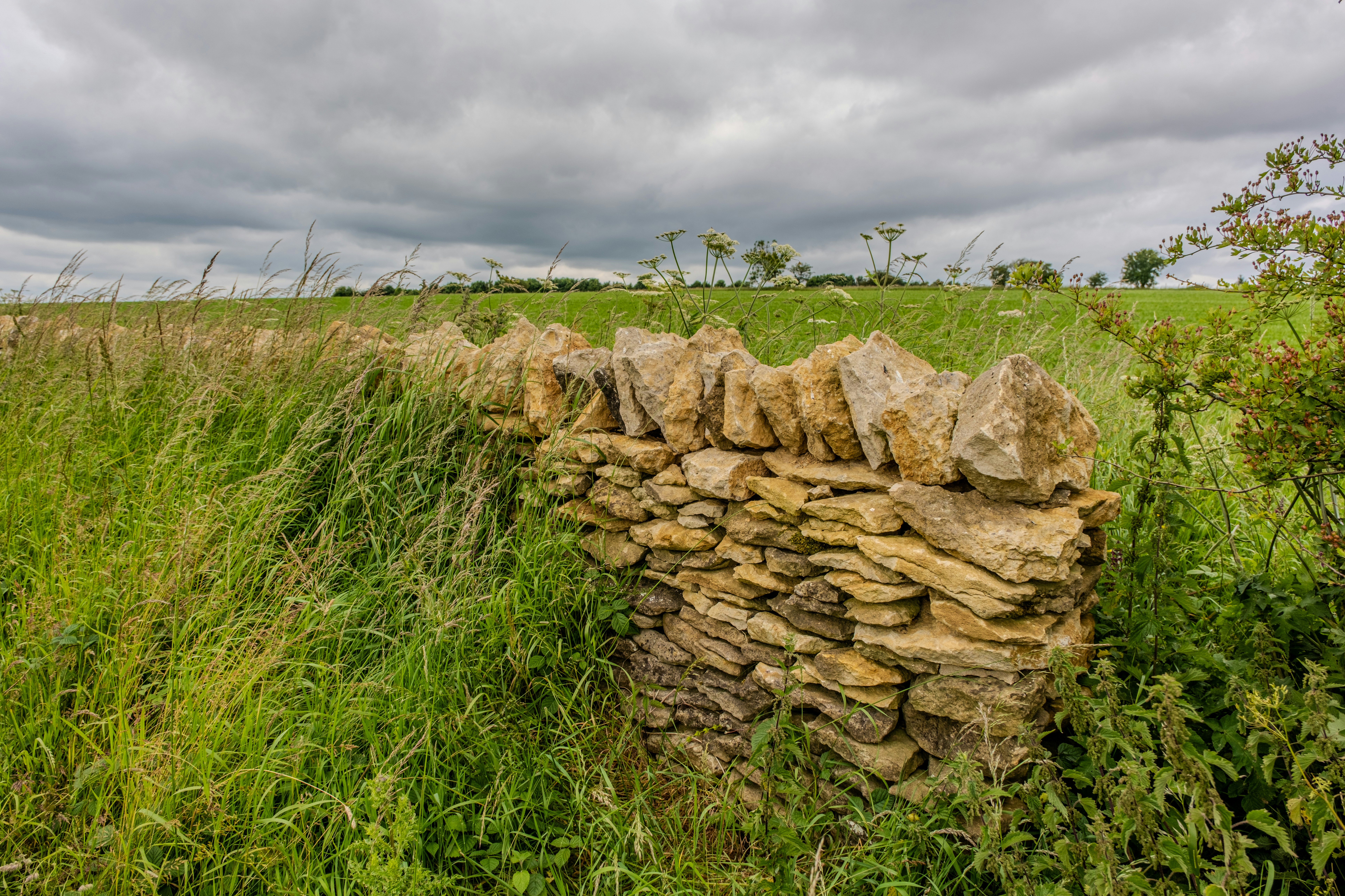 Natural stone retaining wall installation