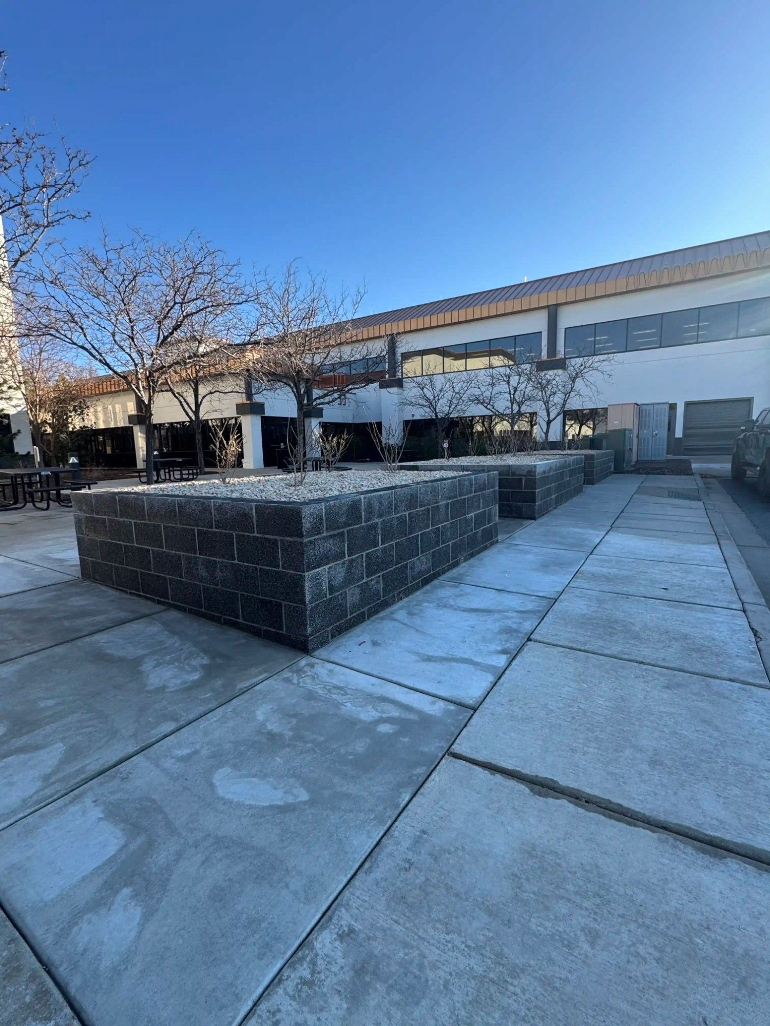 Commercial concrete plaza with CMU planters Utah