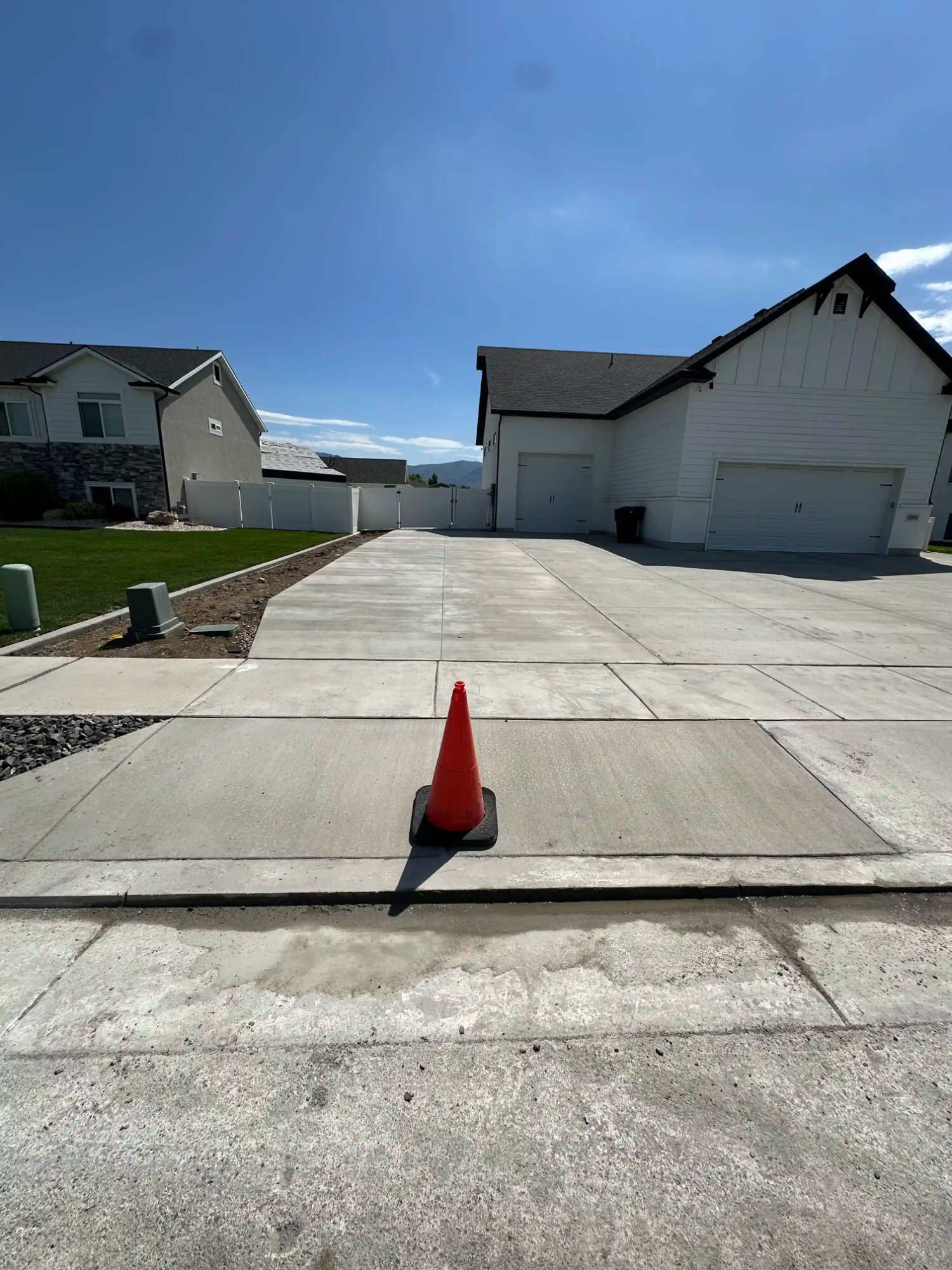 Finished concrete driveway with mountain backdrop, Northern Utah
