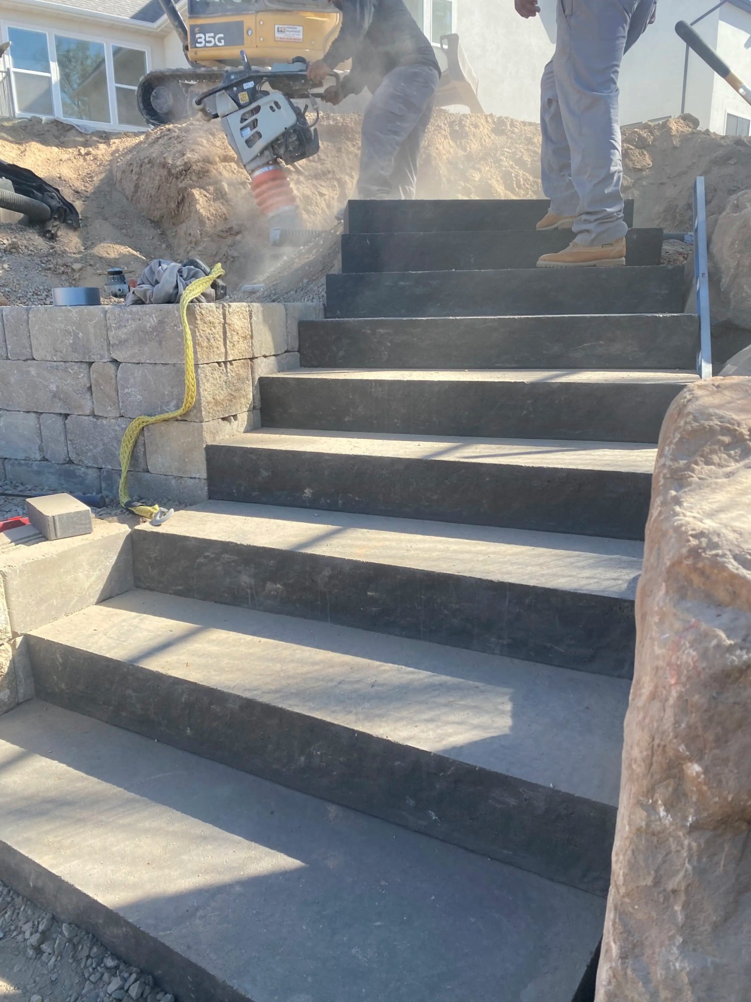 Finished double-garage concrete driveway in Roy