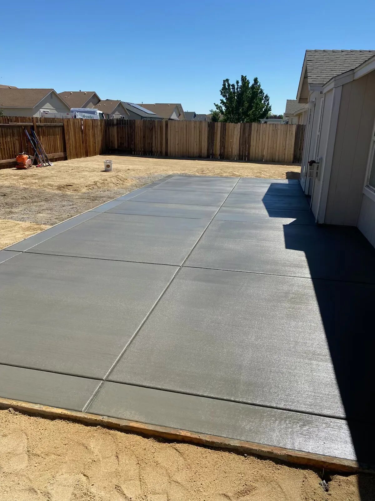 Finished backyard concrete patio in Clinton