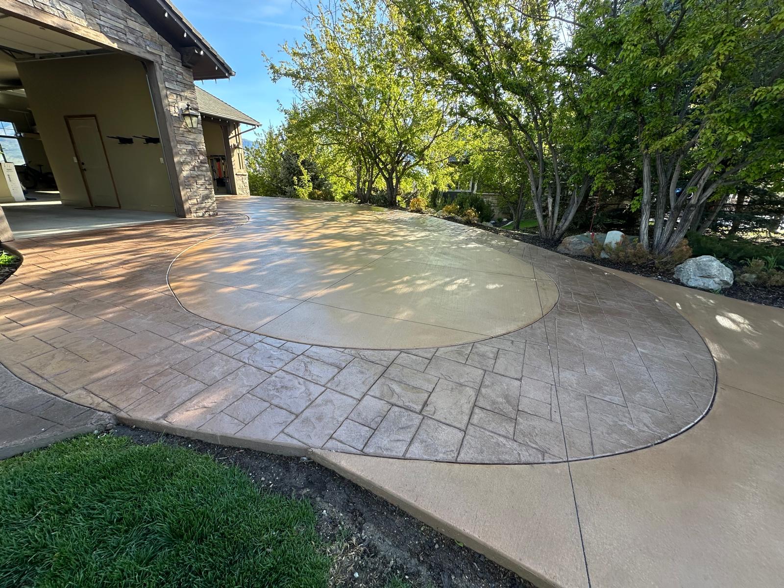 Side angle view of stamped concrete driveway with decorative border, Northern Utah