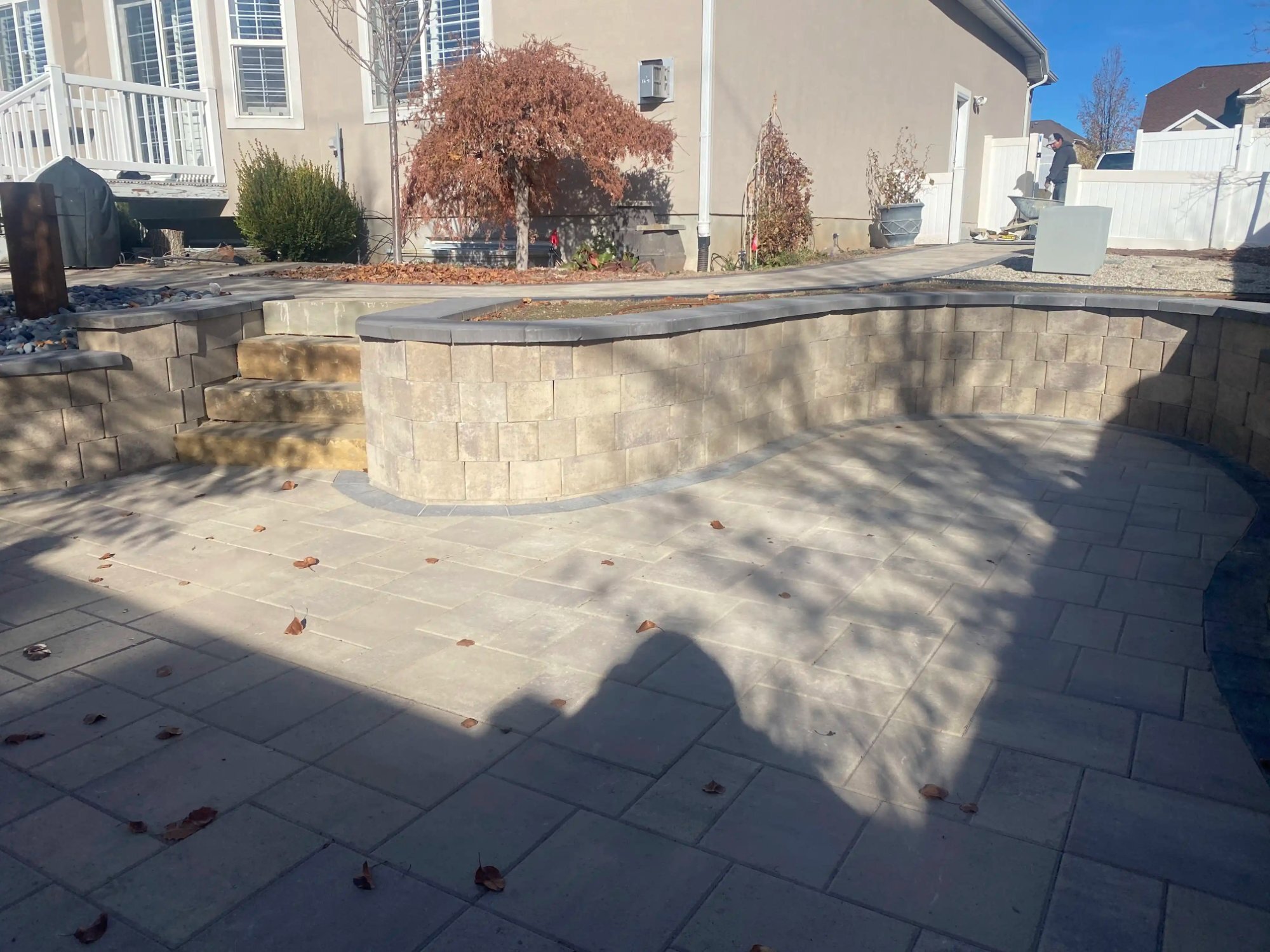 Curved seating wall and fire pit paver patio, Utah
