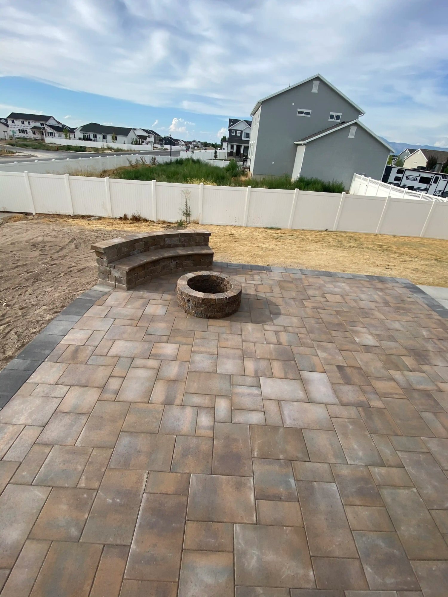 Fire pit curved seating paver patio