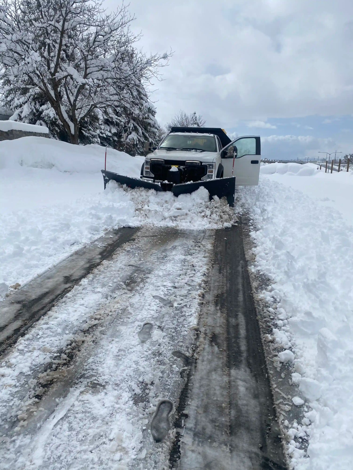 Plow truck head on snow removal Northern Utah